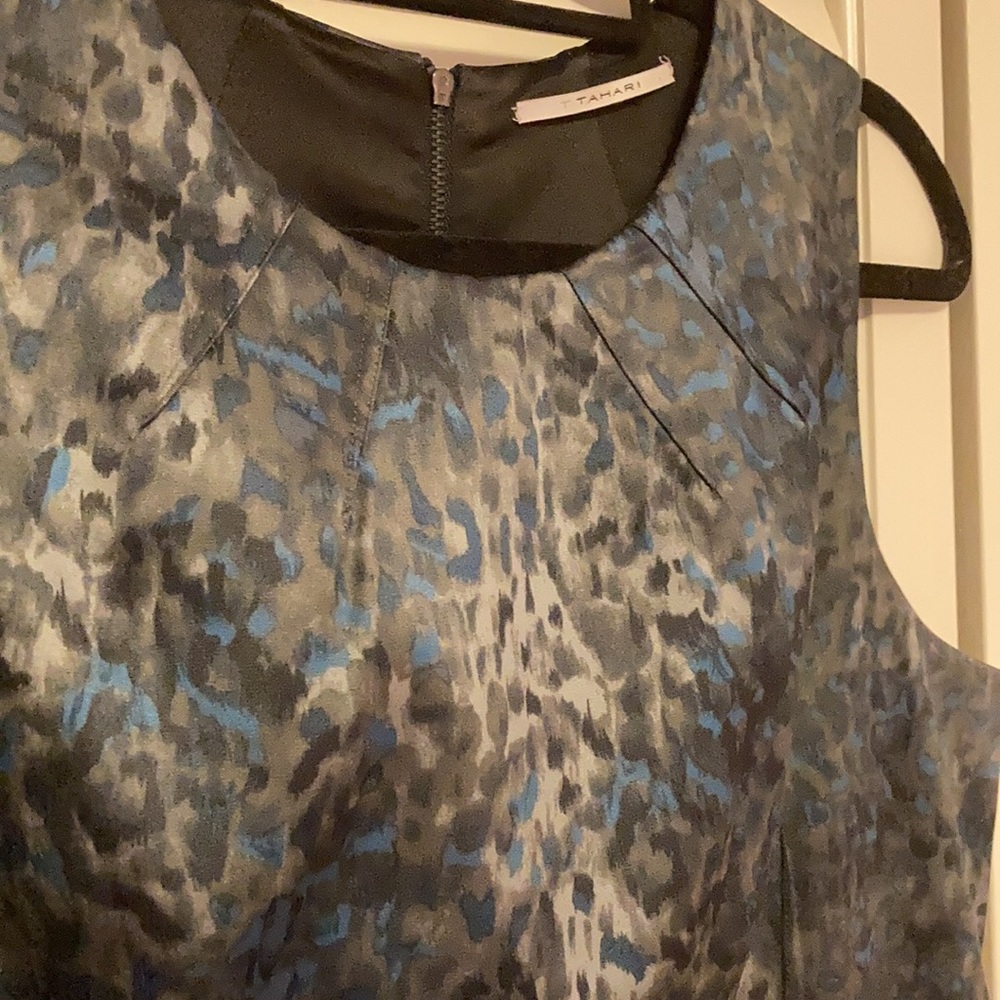 Sleeveless fitted sheath dress.